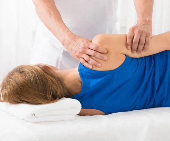 woman being treated with acupressure techniques